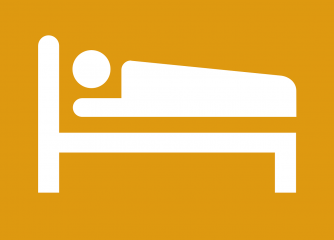 Symbolbild med säng i vitt mot orange bakgrund